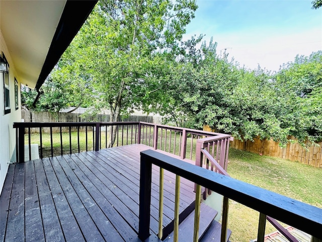 wooden terrace with a lawn