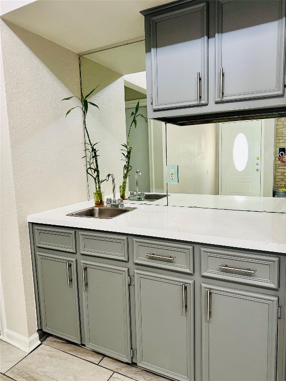 kitchen with sink and light tile patterned floors