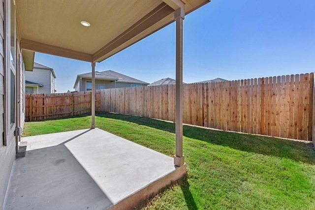 view of yard with a fenced backyard and a patio