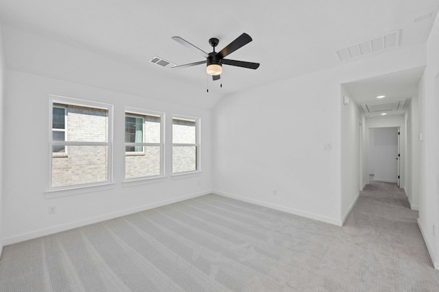 carpeted spare room with ceiling fan