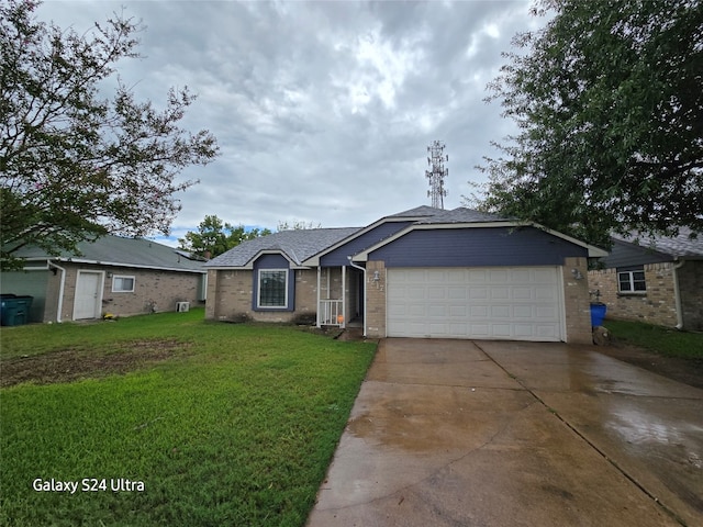 single story home with a garage and a front yard