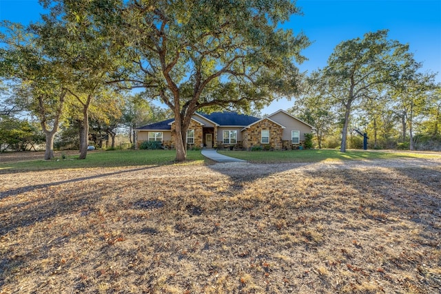 ranch-style home featuring a front yard