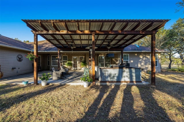 view of front of house with a patio area, a front lawn, ceiling fan, and a pergola