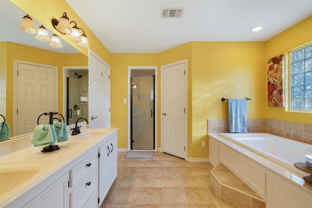 bathroom with vanity, plus walk in shower, and tile patterned floors