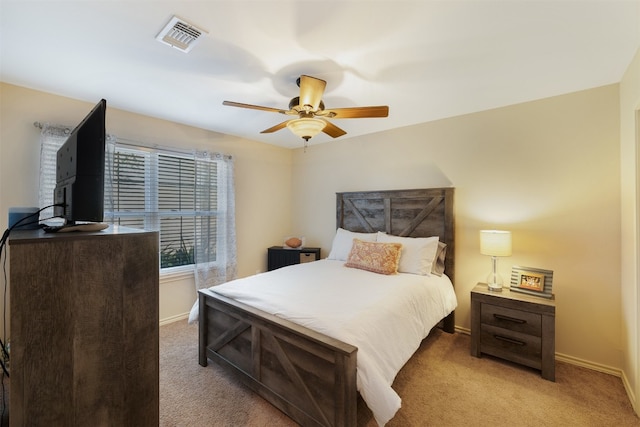 carpeted bedroom featuring ceiling fan