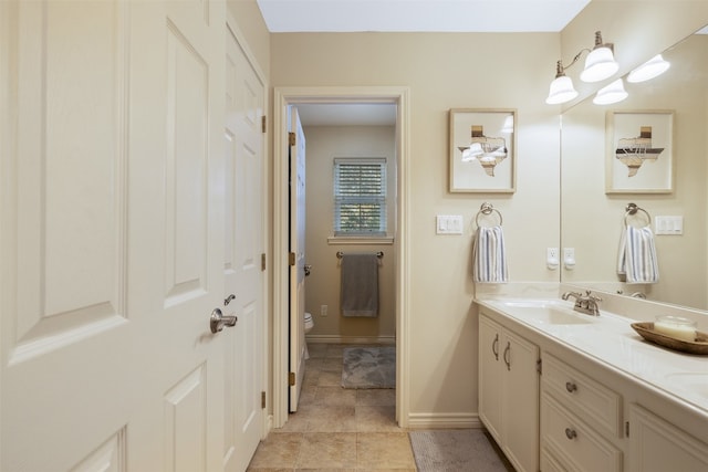 bathroom featuring vanity, toilet, and tile patterned floors