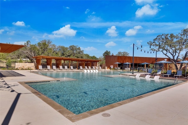 view of swimming pool featuring a patio area