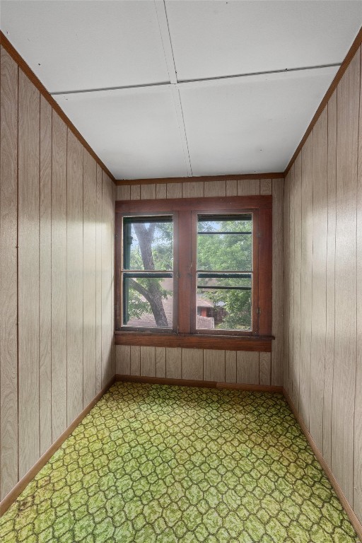 tiled empty room with wooden walls