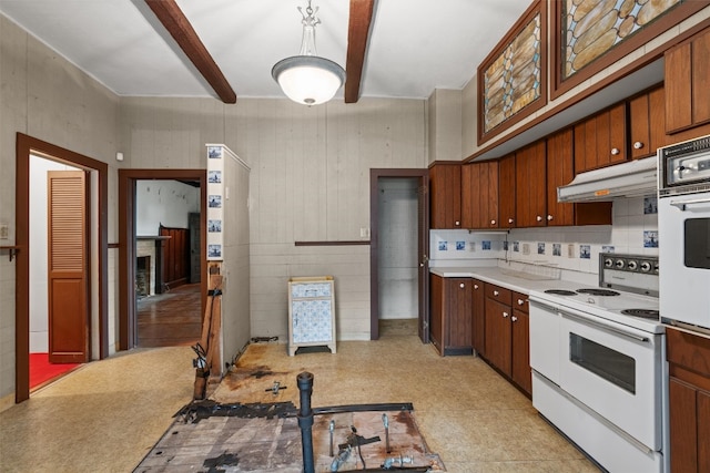 kitchen with refrigerator and white range with electric stovetop