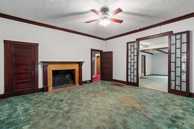 unfurnished living room with carpet, ceiling fan, a textured ceiling, and a brick fireplace