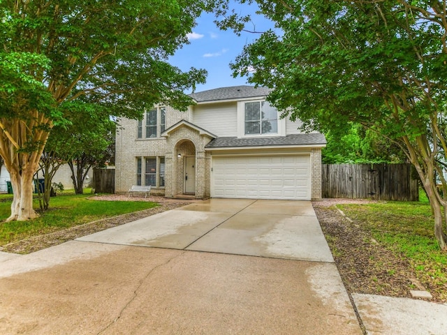 view of front facade featuring a garage and a front lawn