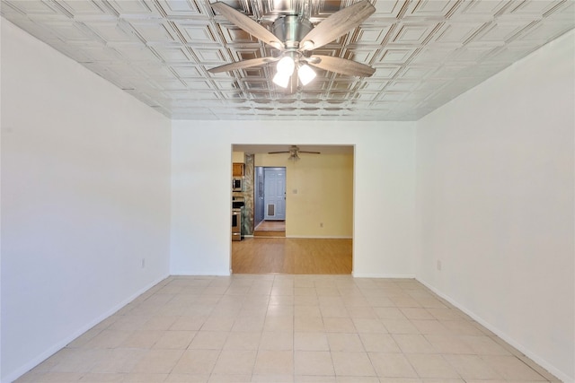 unfurnished room featuring ceiling fan and light hardwood / wood-style flooring