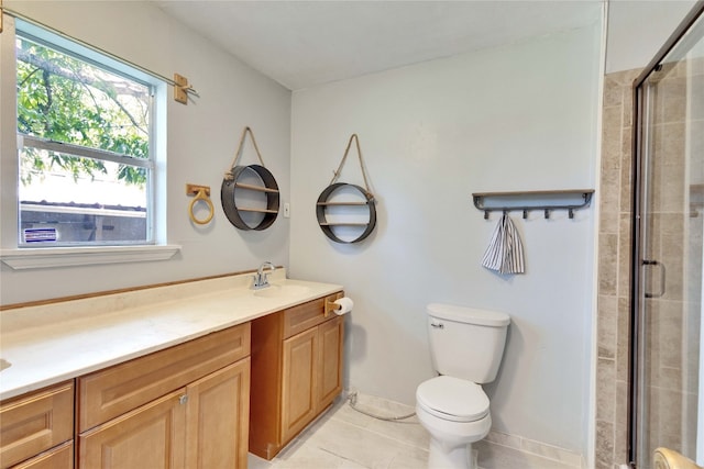 bathroom with tile patterned flooring, an enclosed shower, vanity, and toilet