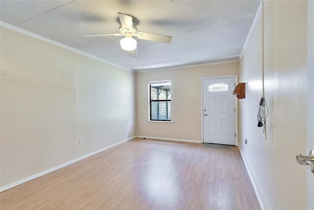 entryway with ceiling fan, light wood-type flooring, and crown molding