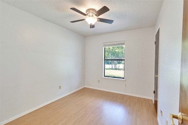 unfurnished room with light wood-type flooring, ceiling fan, and a textured ceiling