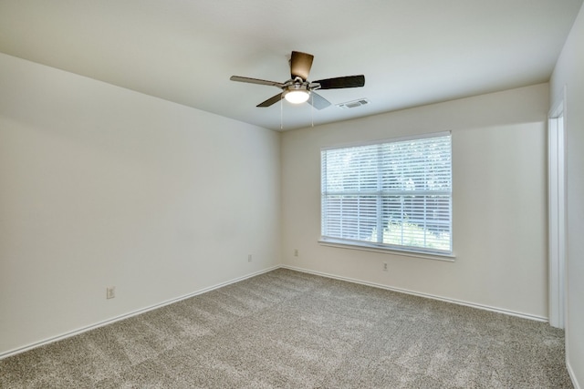 spare room with ceiling fan and carpet flooring