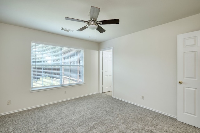 carpeted empty room with ceiling fan