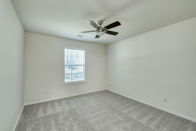 unfurnished room featuring carpet floors and ceiling fan