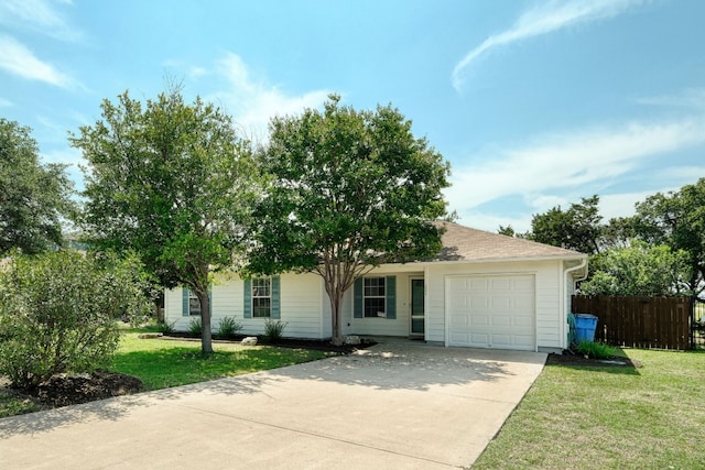 view of front of house featuring a front yard and a garage