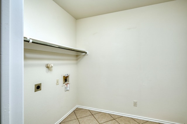 laundry room featuring hookup for an electric dryer, hookup for a washing machine, and light tile floors