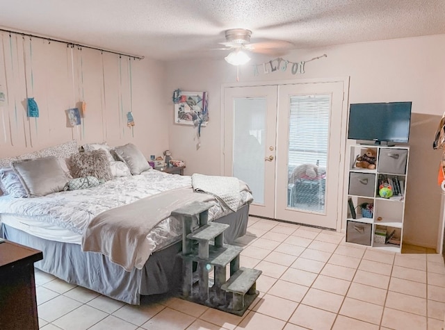 bedroom featuring french doors, ceiling fan, a textured ceiling, and light tile patterned floors