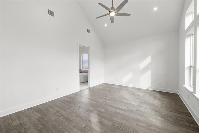 spare room featuring ceiling fan, high vaulted ceiling, and wood-type flooring