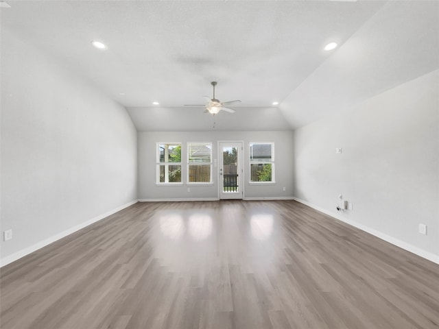 spare room with ceiling fan, hardwood / wood-style floors, and lofted ceiling