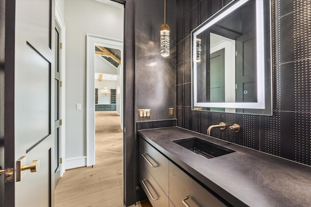 bathroom featuring vanity and wood-type flooring