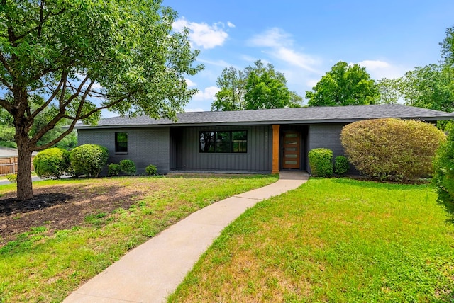 ranch-style home with a front lawn