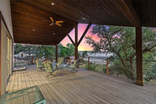 deck at dusk with ceiling fan