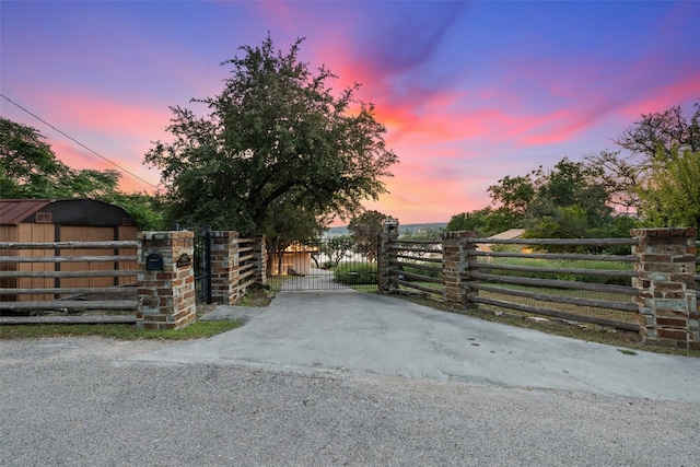 view of gate at dusk