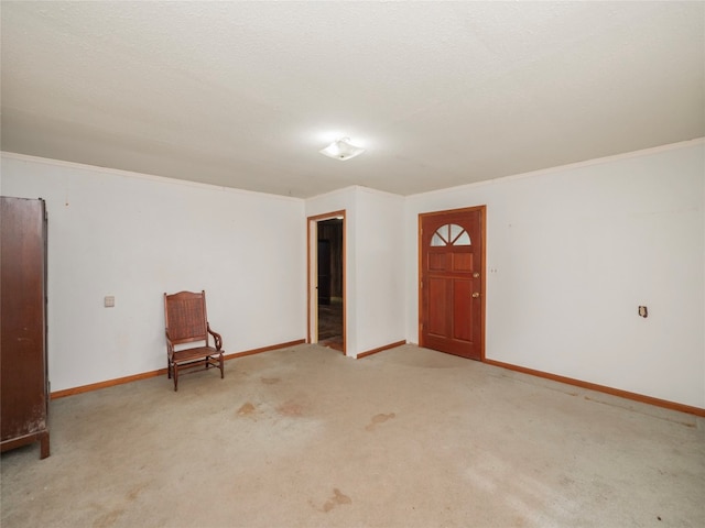 interior space featuring a textured ceiling and crown molding