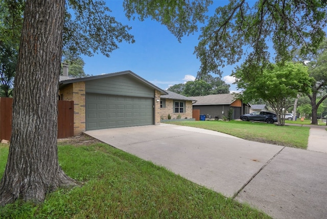 ranch-style home with a front yard and a garage