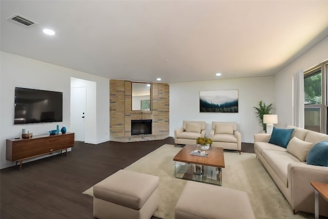 living room featuring a fireplace and hardwood / wood-style flooring