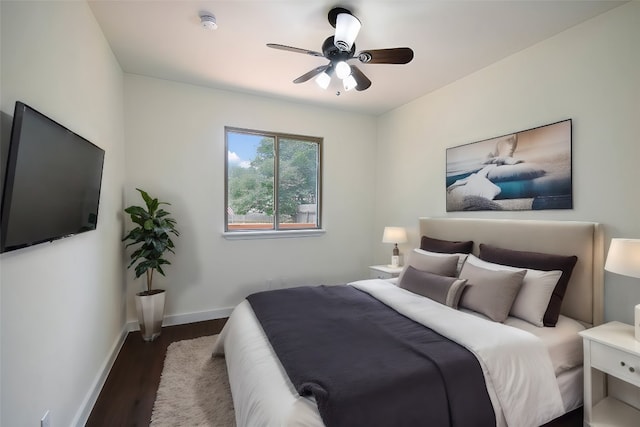 bedroom featuring ceiling fan and dark hardwood / wood-style flooring