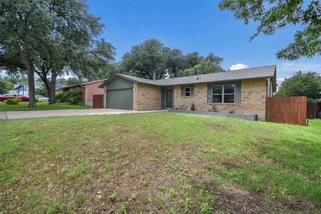 ranch-style home with a front lawn and a garage