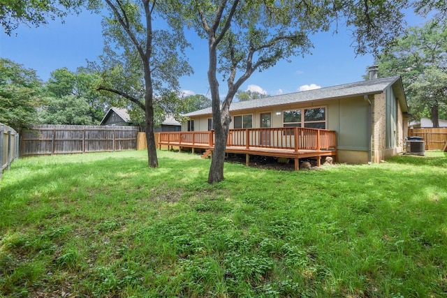 back of house featuring central air condition unit, a lawn, and a deck