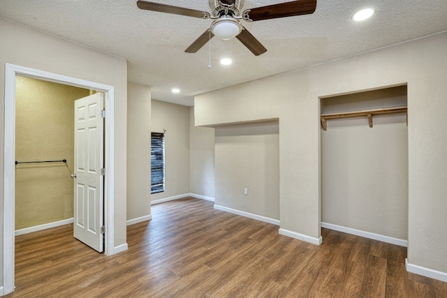 unfurnished bedroom featuring a textured ceiling, ceiling fan, and hardwood / wood-style floors