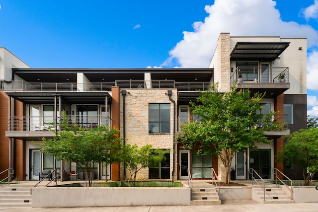 view of front of property with a balcony