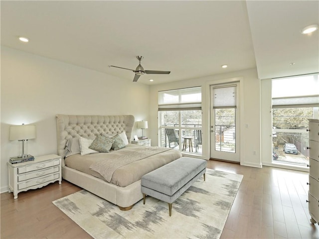 bedroom with ceiling fan, hardwood / wood-style flooring, and access to exterior