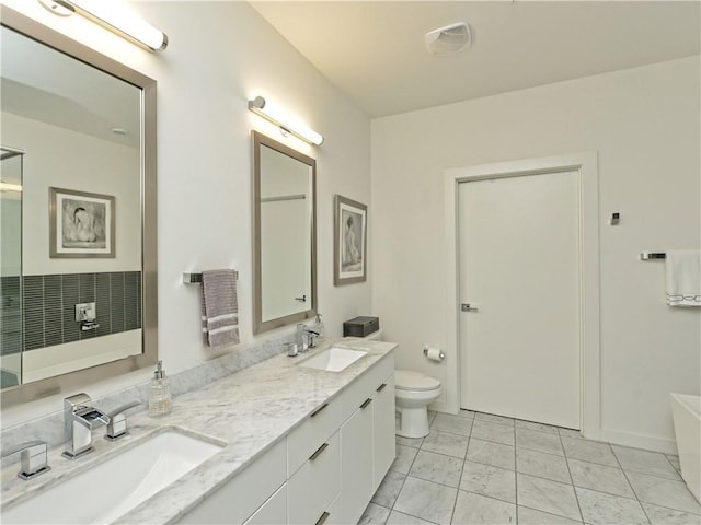 bathroom featuring vanity and toilet