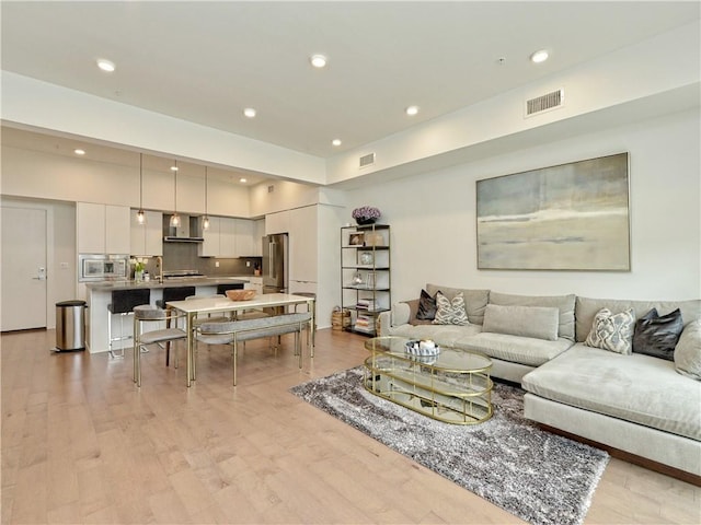 2003 Wilson St Unit 2, Austin, TX 78704 - living room featuring recessed lighting, visible vents, and light wood finished floors