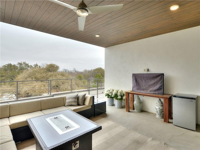 view of patio with ceiling fan and outdoor lounge area