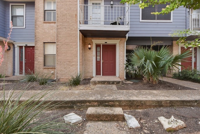 property entrance with a balcony