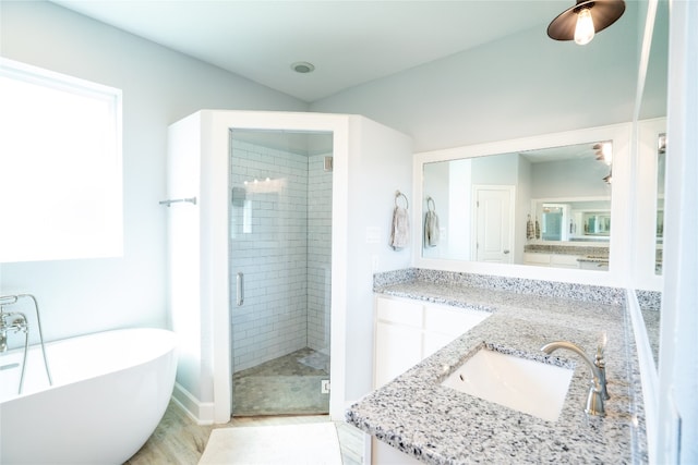 bathroom with vanity and plus walk in shower