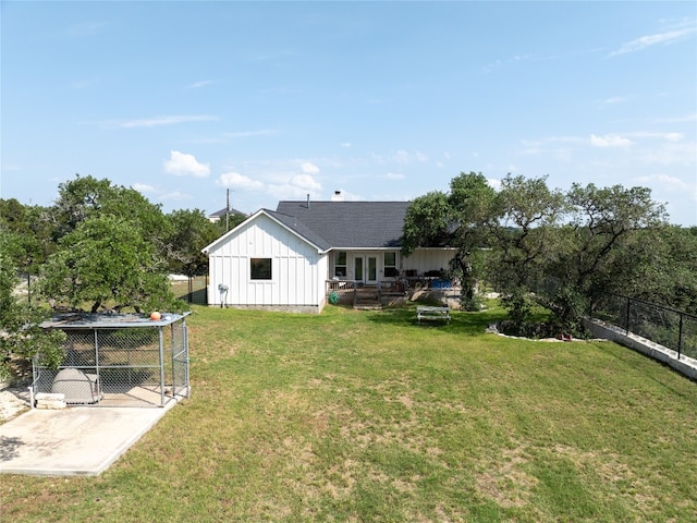 view of yard with a shed and a patio