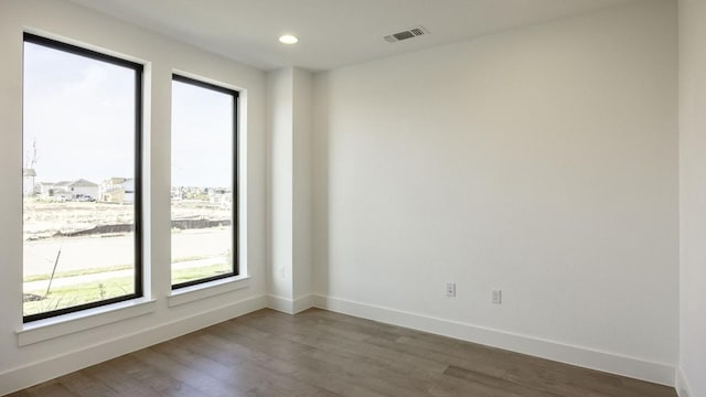 empty room featuring hardwood / wood-style floors