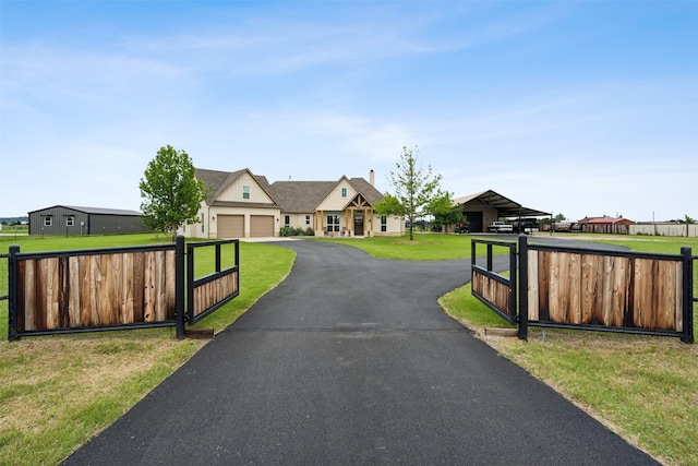 view of front of property with a garage and a front yard