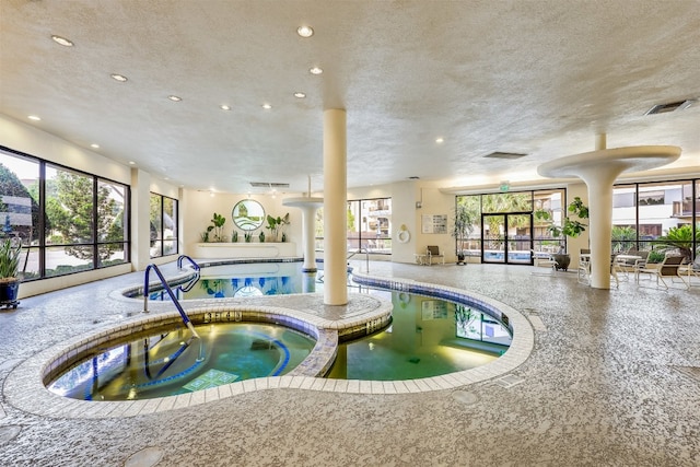 pool featuring an indoor hot tub