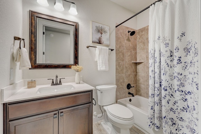 full bathroom featuring shower / bath combo with shower curtain, vanity, and toilet